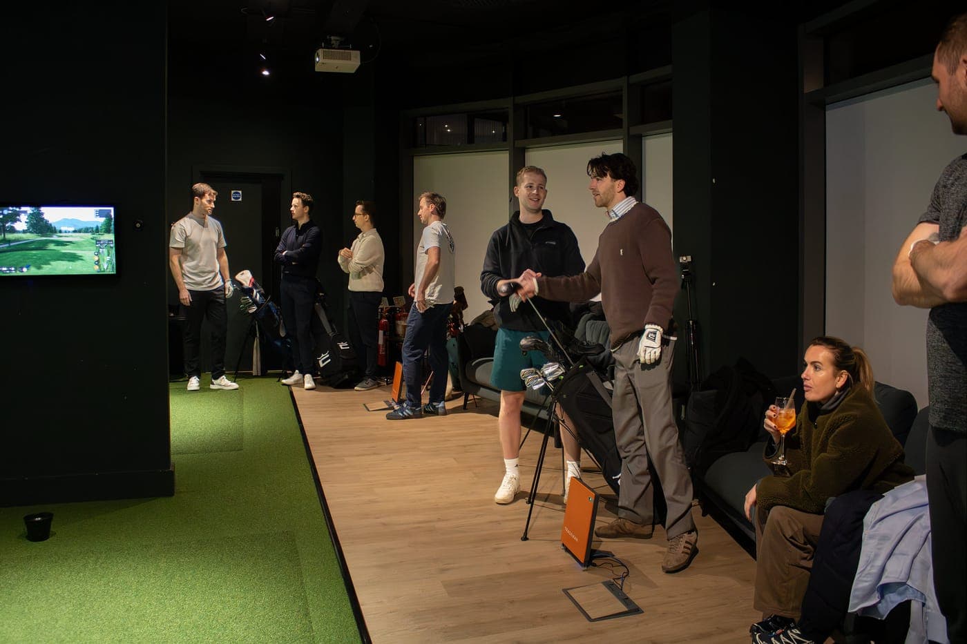 Friends sharing a simulator bay at Caddi Club Fulham