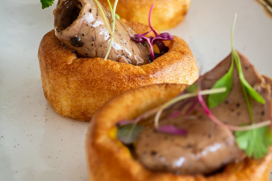Mini Yorkshire puddings filled with roast beef and herbs